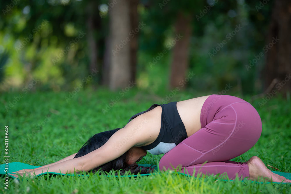Fototapeta premium Beautiful asian fat woman play yoga at the park,Need to slim fit body