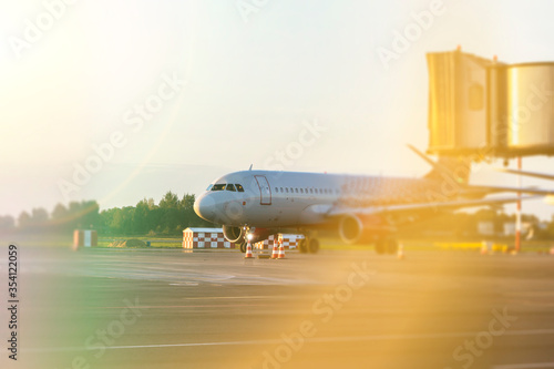 Colorful of sunset in the airport with aeroplane wing, Business and transportation concept. © mihail39