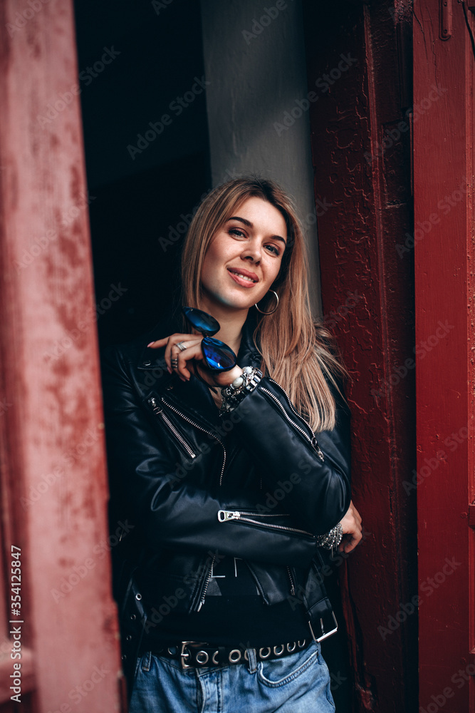 Obraz premium Portrait of a young girl. Photo session of a stylish girl outdoors. 