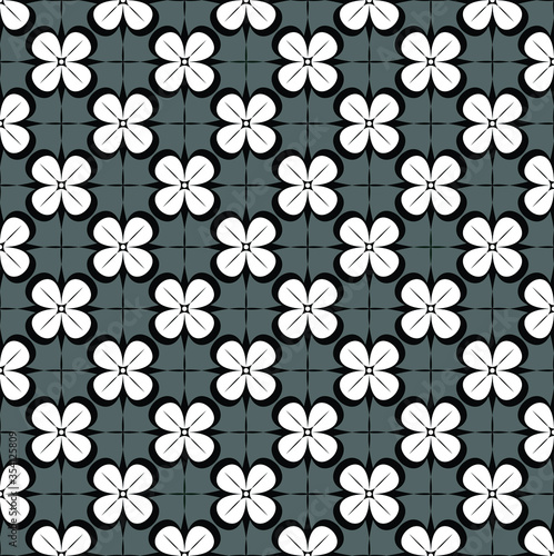 geometrical four petal pattern in black and white with grey color background