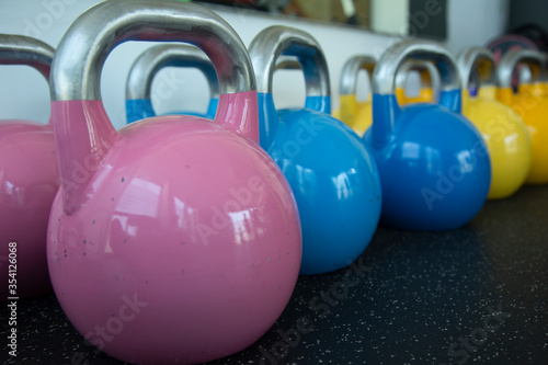 a set of colorful kettlebells
