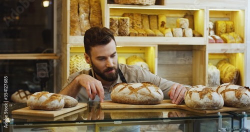 Portrait of male baker working in bakery shop