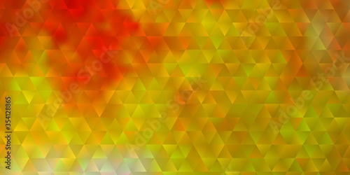 Light Orange vector background with triangles.