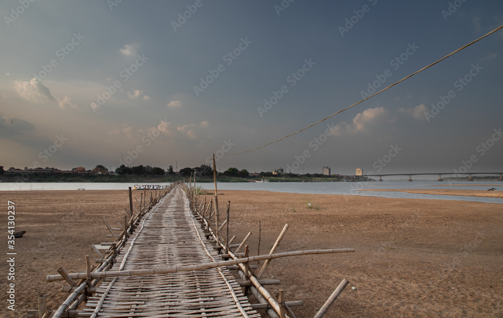 old traditional bamboo wooden bridge across Mekong river (from Koh Paen island to Kampong Cham), Cambodia