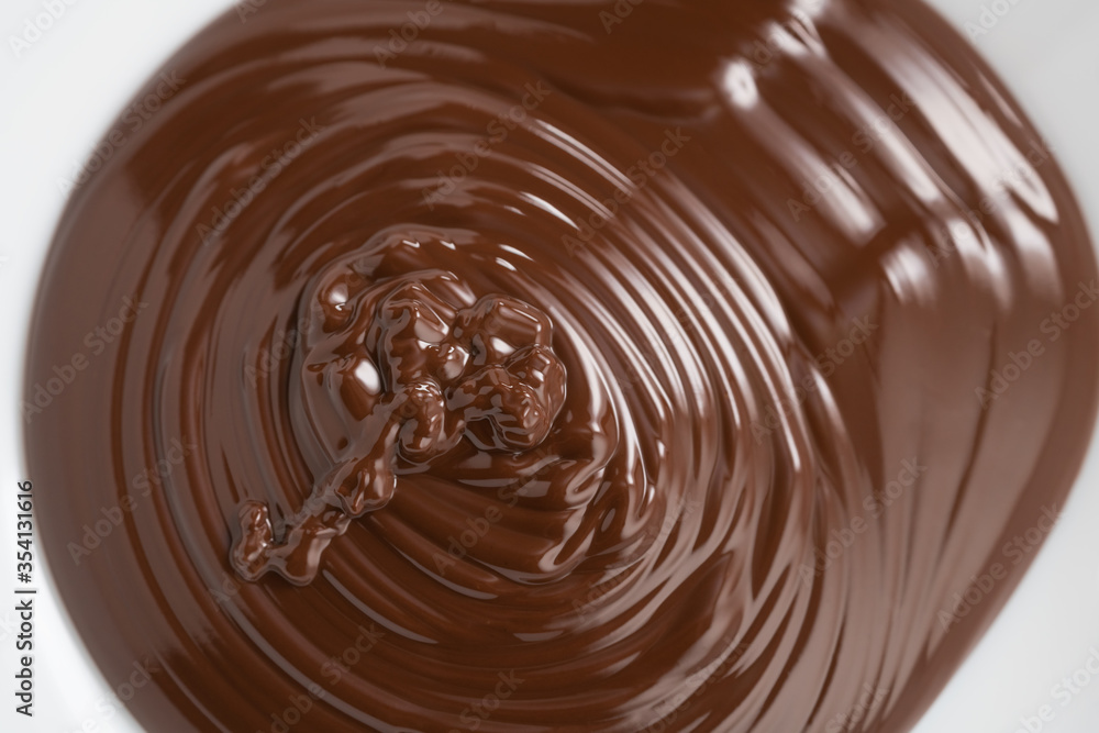 poured melted dark chcolate background closeup poured melted dark chcolate background closeup