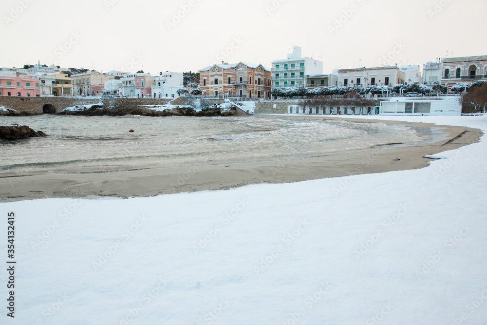 Santa Maria al Bagno beach after a exceptional snowfall, Salento, Italy