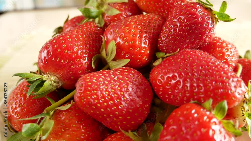 Ripe appetizing strawberries. Juicy ripe strawberries lie on a plate. Large plan. Panorama Ripe appetizing strawberries. Juicy ripe strawberries lie on a plate. Large plan. Panorama