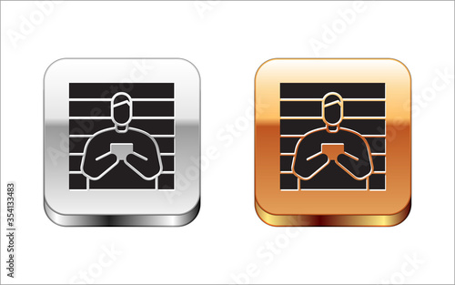 Black Suspect criminal icon isolated on white background. The criminal in prison, suspected near the board. Silver-gold square button. Vector Illustration.