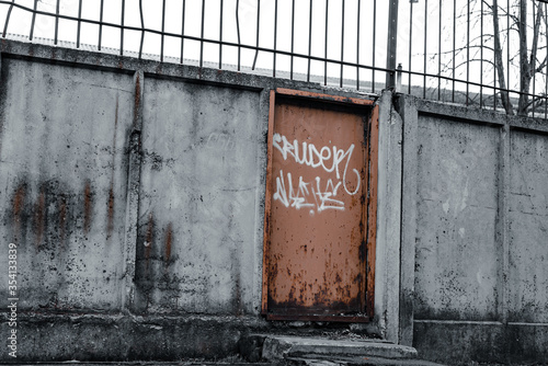 Tagged door in easter europe in urban environment