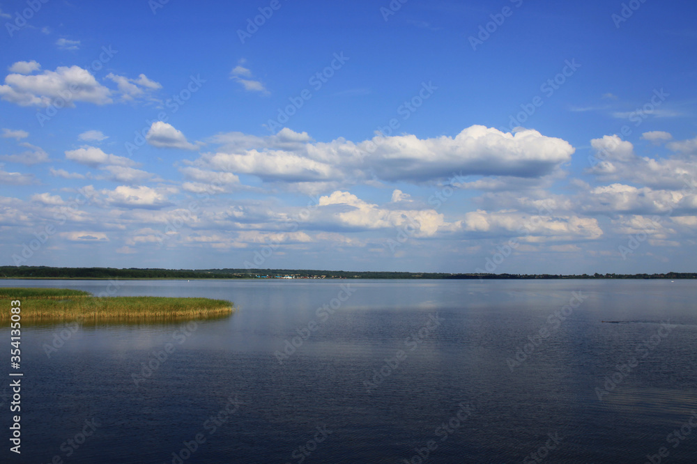 White clouds above lake Seliger