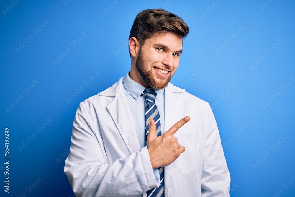 Young blond therapist man with beard and blue eyes wearing coat and tie over background cheerful with a smile of face pointing with hand and finger up to the side with happy and natural expression Young blond therapist man with beard and blue eyes wearing coat and tie over background cheerful with a smile of face pointing with hand and finger up to the side with happy and natural expression