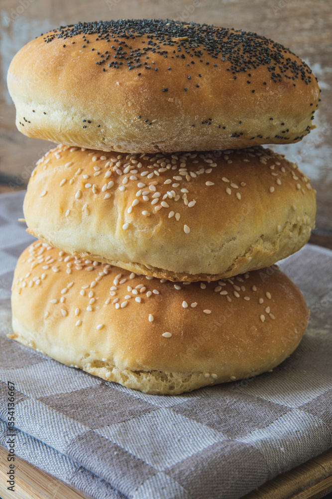 Homemade burger bread with poppy seeds and sesame Homemade burger bread with poppy seeds and sesame
