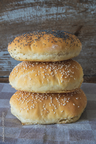 Homemade burger bread with poppy seeds and sesame