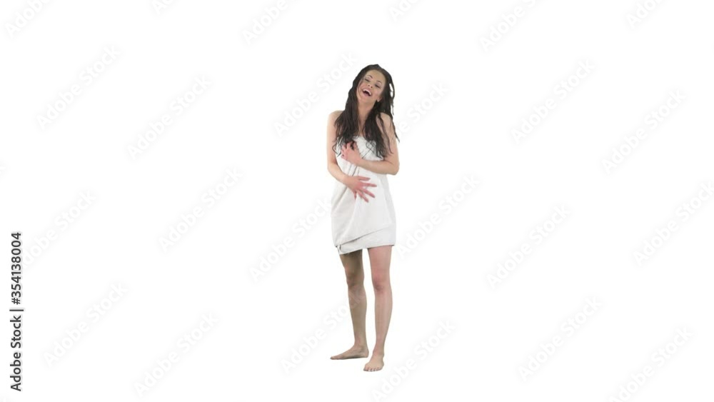 Happy young beautiful woman in towel laughing hard having fun hearing jokes isolated on solid white background. Happy young beautiful woman in towel laughing hard having fun hearing jokes isolated on solid white background.