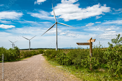 Wind turbines on Whitelee wind farm in Scotland on a  sunny spring day. photo