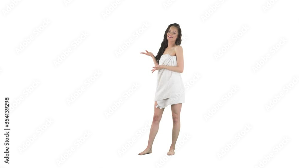 Young attractive woman with wet hair in towel announcing and presenting blank copy space isolated on solid white background. Young attractive woman with wet hair in towel announcing and presenting blank copy space isolated on solid white background.