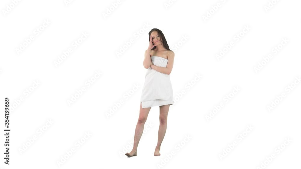 Bored and tired young frustrated woman waiting impatient wrapped in towel after showering with wet hair isolated on solid white background. Bored and tired young frustrated woman waiting impatient wrapped in towel after showering with wet hair isolated on solid white background.
