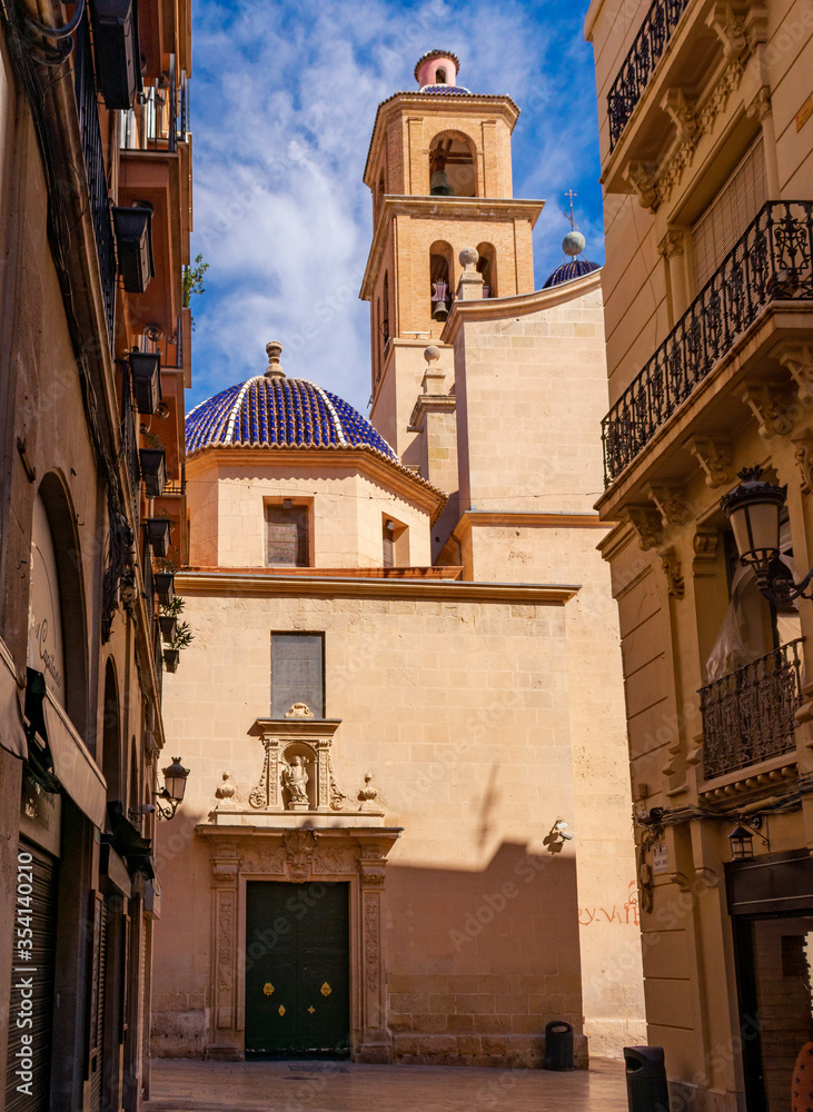 Fototapeta premium View from Saint Joseph street of the tower of the Sant Nicalau de Bari Co-Cathedral. Alicante Spain