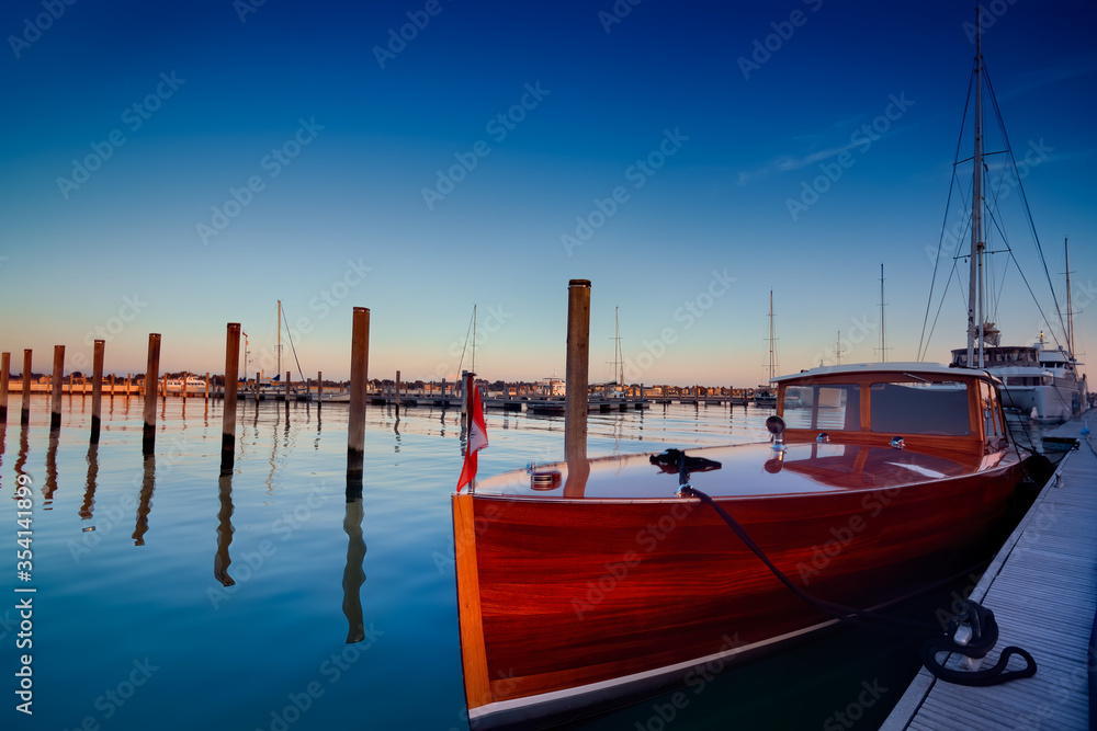 Classic mahogany luxury boat moored, Venice, Italy.