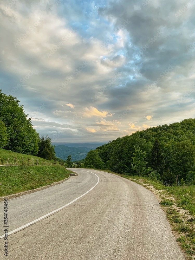 Landscape photography of road with dramatic cloud in background
