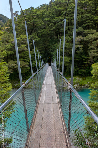 Fototapeta Naklejka Na Ścianę i Meble -  Suspension Bridge over the Makarora River, Blue Pools, South Island, New Zealand