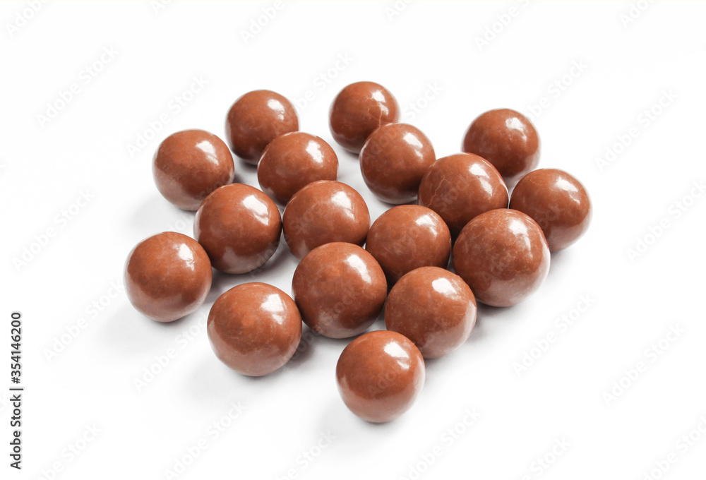 Shiny and smooth chocolate covered balls. Tasty treat isolated on white background Shiny and smooth chocolate covered balls. Tasty treat isolated on white background