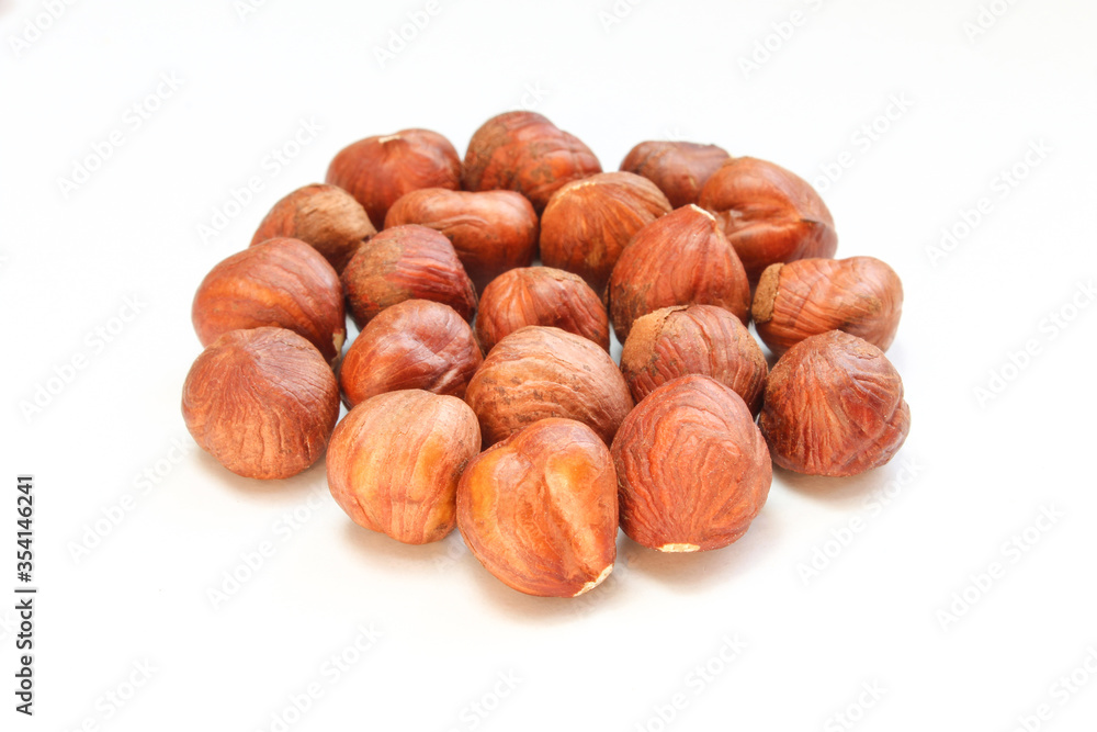 Peeled hazelnuts isolated on white background. No shell Peeled hazelnuts isolated on white background. No shell