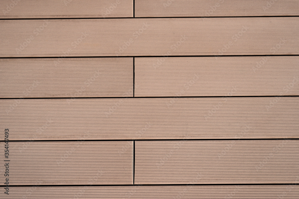 Obraz premium The texture of the flooring of wooden boards with parallel lines, tinted in a monotone brown color