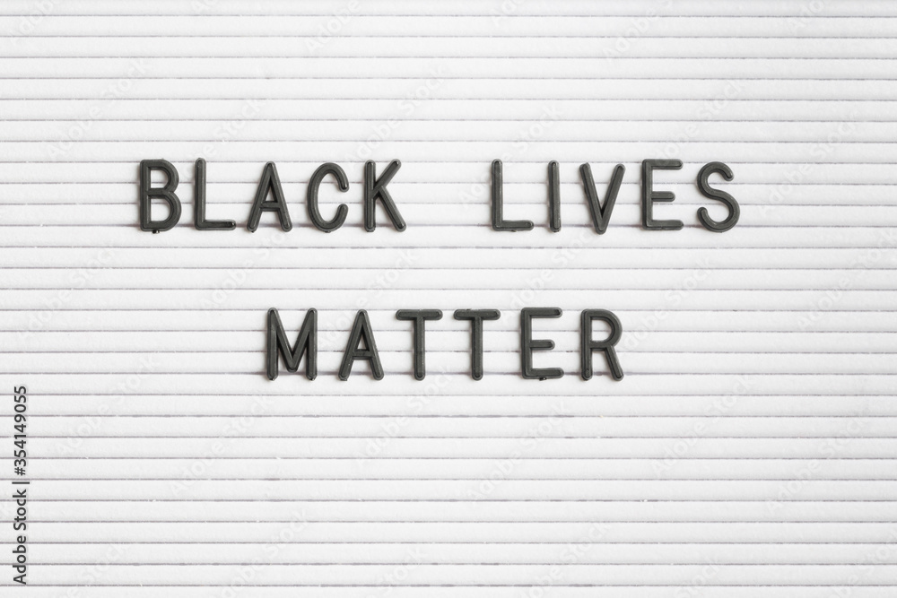 BLACK LIVES MATTER text poster on white letter board. Protest against police killing people