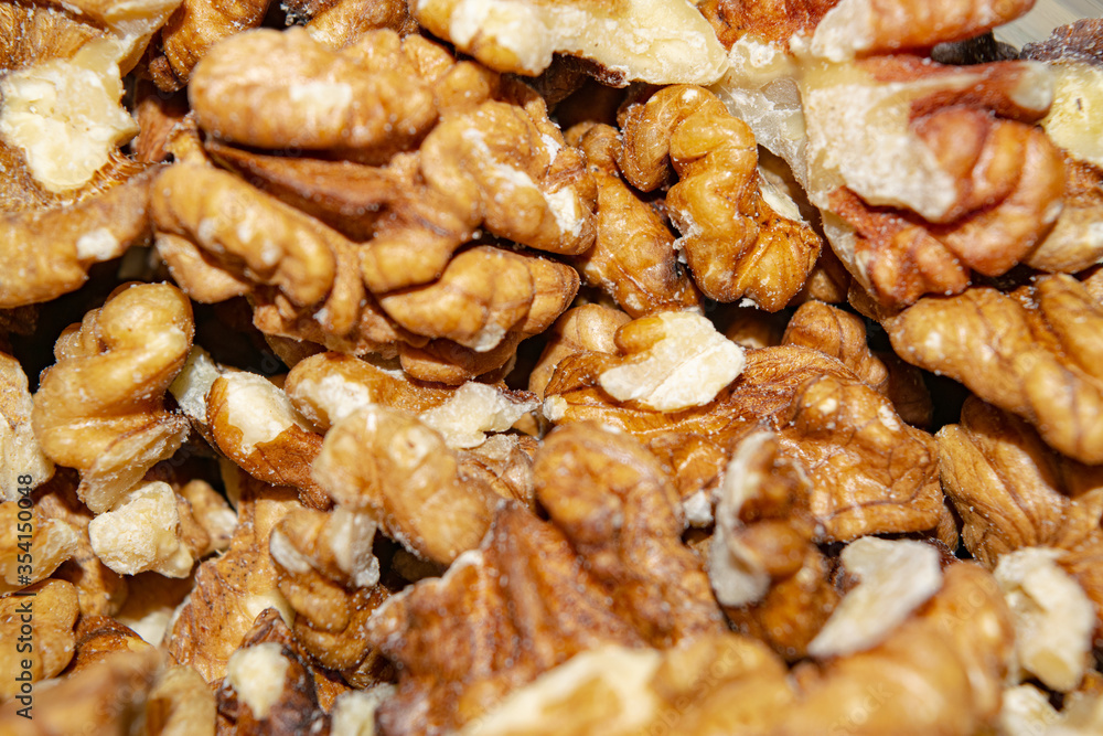 Peeled walnuts close-up. Surface texture. Healthy diet. Peeled walnuts close-up. Surface texture. Healthy diet.