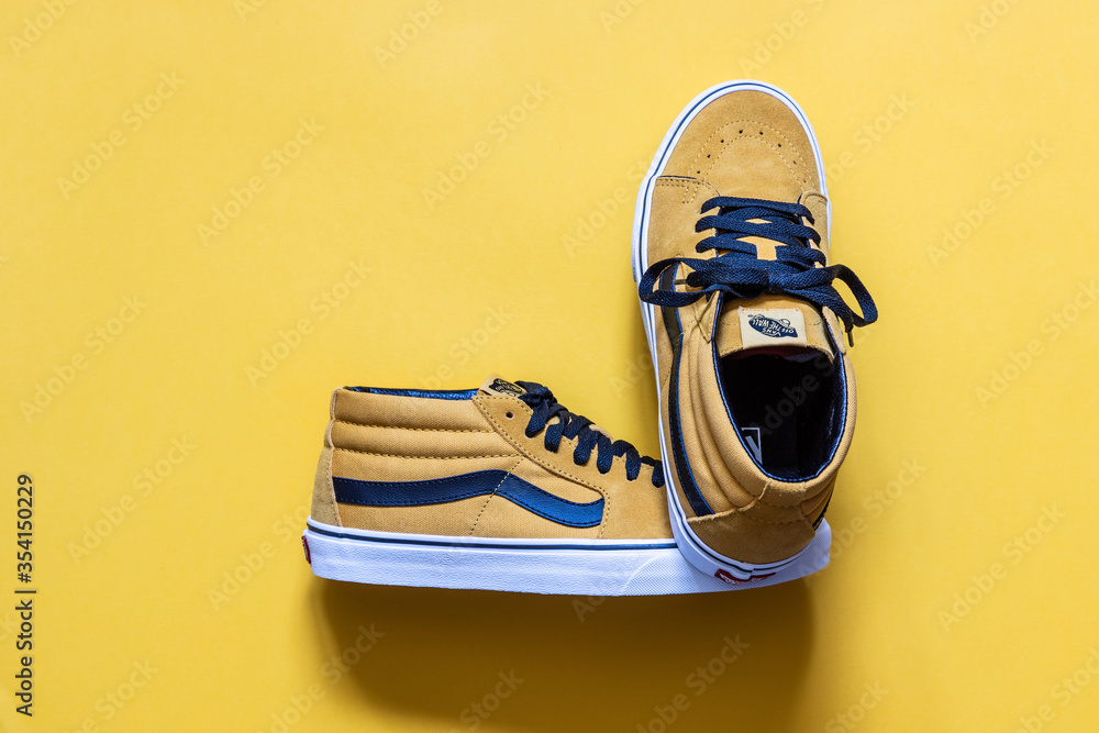 Madrid, Spain; May 30 2020: Skate boarding sneakers Vans Sk8 mid mustard  color on yellow background, photograph made in studio Stock Photo | Adobe  Stock