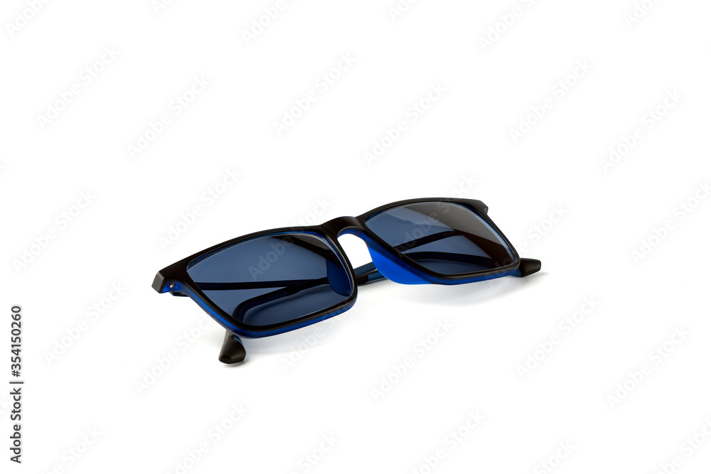 Blue sunglasses isolated on a white background. Blue sunglasses isolated on a white background.