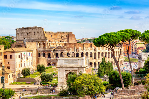The Colosseum and Arch of Constantine in Rome, Italy during summer sunny day. The world famous colosseum landmark in Rome.