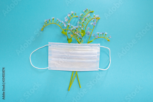 Medical mask and flowers. F...