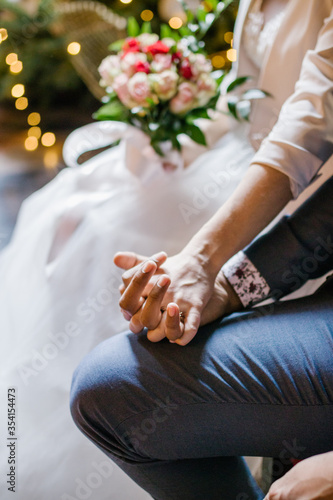 Married couple holding hands during ceremony