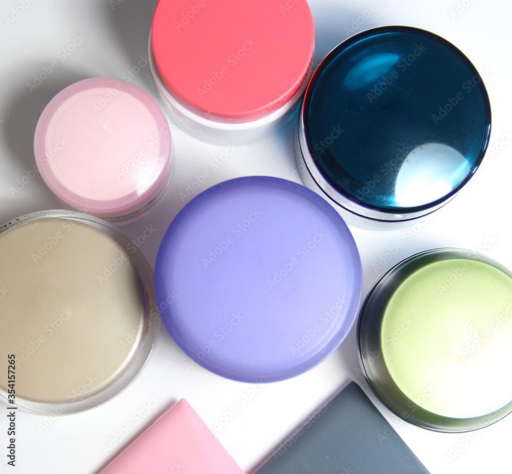 Mix of face creams in the vivid jars and bottles Mix of face creams in the vivid jars and bottles