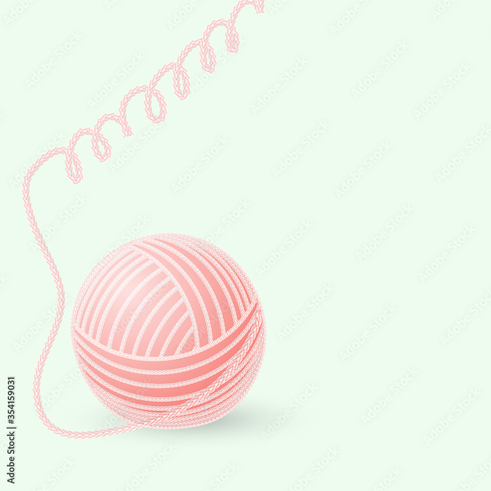 ball of woolen thread on a green background ball of woolen thread on a green background