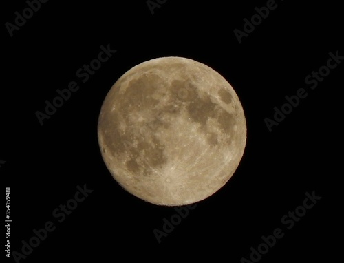 Full moon against the black sky.