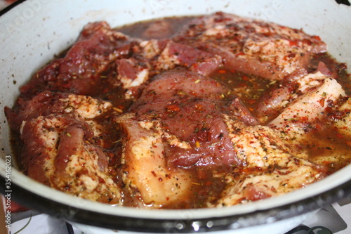 marinated pork meat on the ribs with spices Provencal herbs for frying
