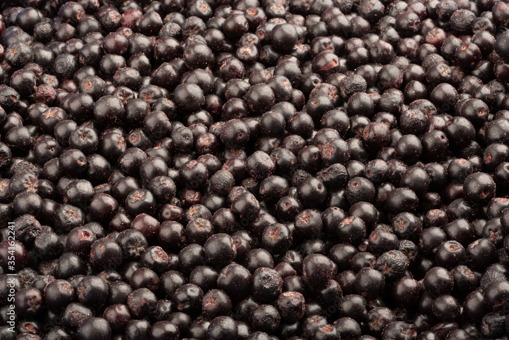 Frozen fresh chokeberry. Food background. Top view. Frozen fresh chokeberry. Food background. Top view.