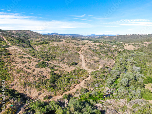 Aerial view of Los Penasquitos Canyon Preserve during dry season. Urban park with mountain  forest and trails in San Diego  California. USA