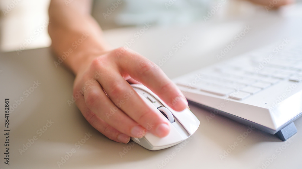the developer works at the computer, uses the mouse the developer works at the computer, uses the mouse