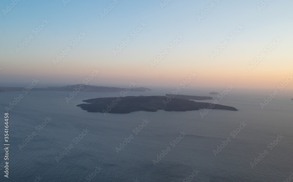 Tholos and Thirasia islands of Santorini after sunset