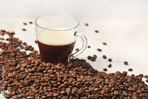coffee in a glass Cup on the background of coffee beans