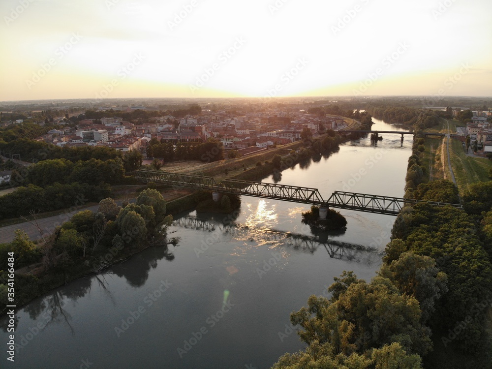Aerial view of a bridge over the river in northern Italy.