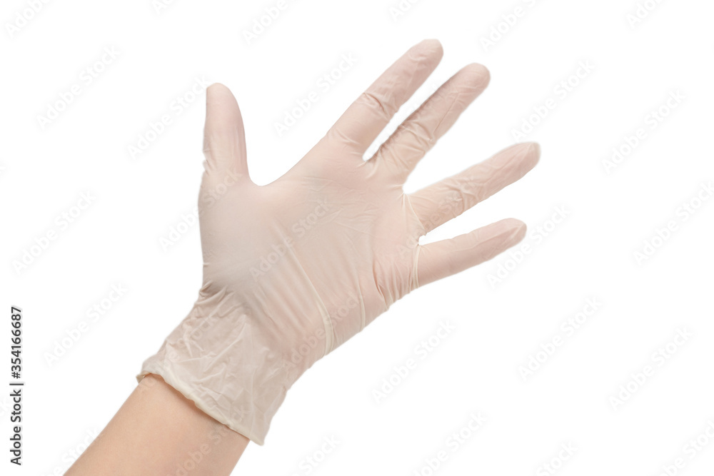 Woman puts on white rubber gloves. Woman puts on white rubber gloves.