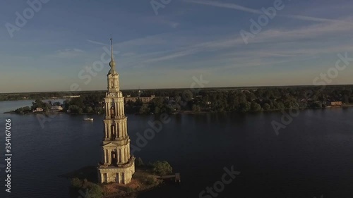 KALYAZIN, RUSSIA-15/08/2019: Fly over the water near the flooded bell tower in the middle of the Volga river in the city of Kalyazin