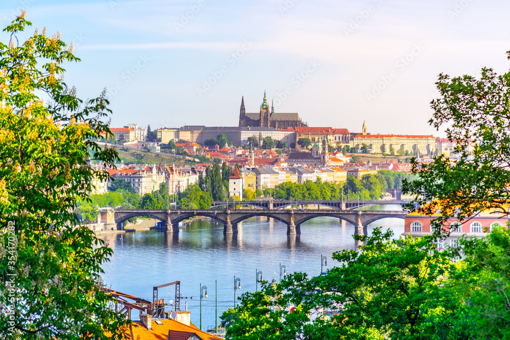 Naklejka premium View of Prague Castle from Vysehrad with lush green spring trees, Prague, Czech Republic