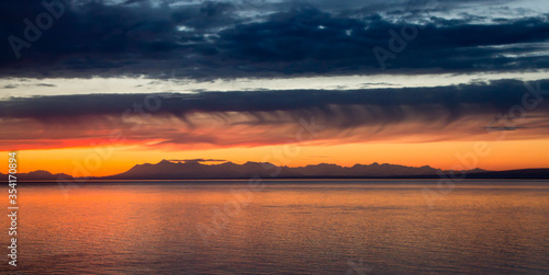 Sunset over Alaska volcanos © Ian
