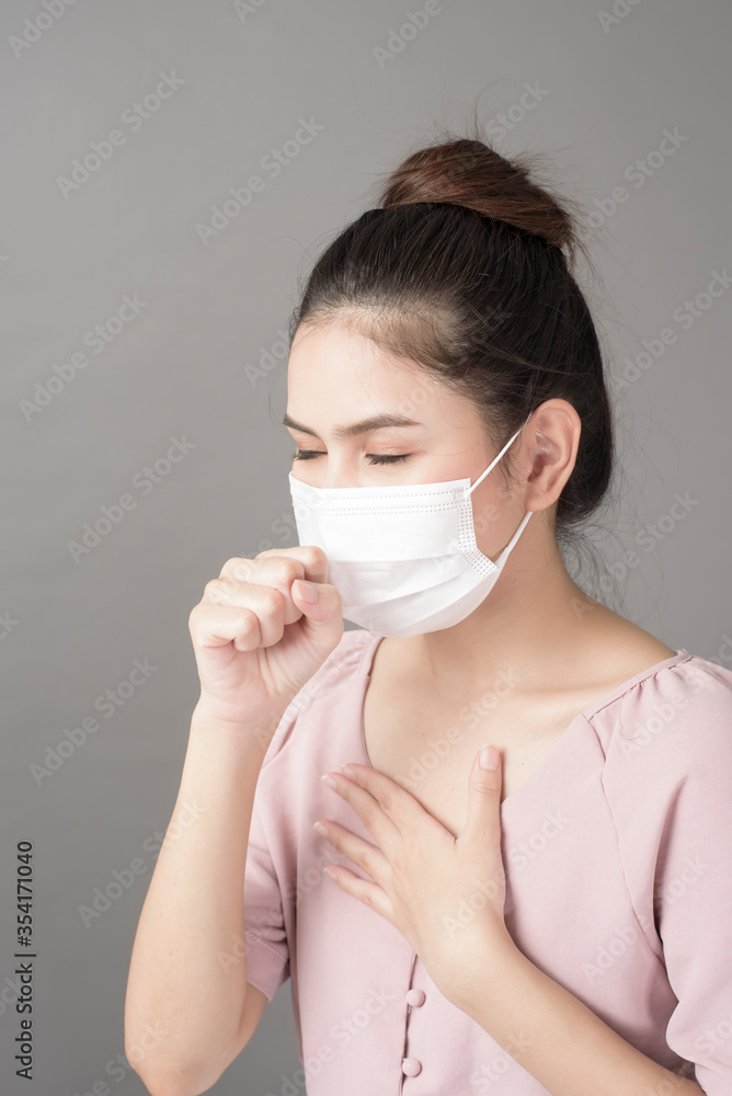 close up woman face is wearing surgical mask close up woman face is wearing surgical mask